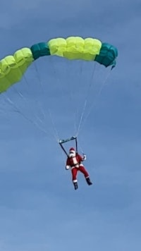 two men posing for a picture in a kitchen