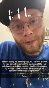 a man wearing glasses and a t - shirt